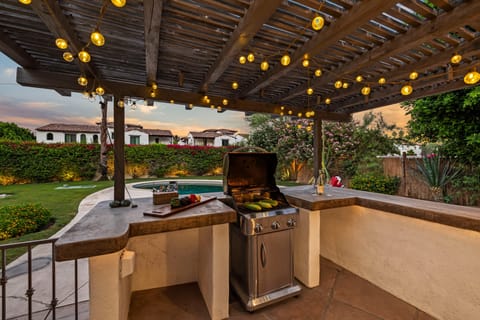 Outdoor kitchen area featuring a BBQ grill.