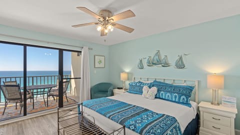 Primary bedroom features a king bed and balcony access.