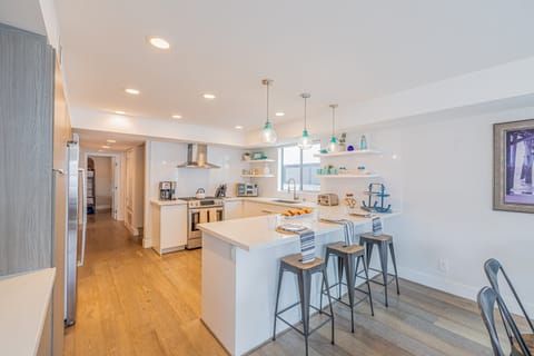 Barstool seating at the fully equipped kitchen.
