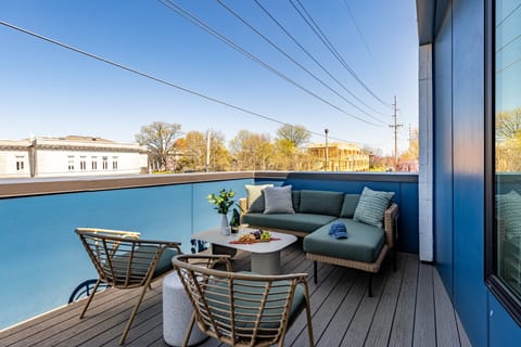 Private balcony with comfortable outdoor seating.