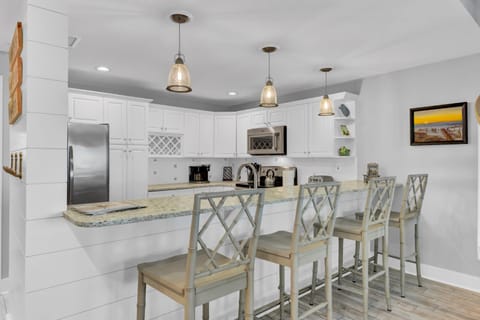 Barstool seating at the breakfast counter.