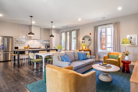 Spacious open-concept living, dining, and kitchen area perfect for modern living and entertaining.