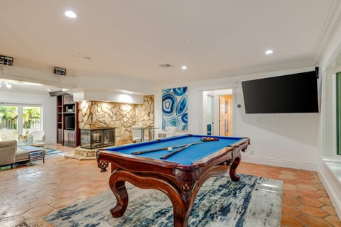 Pool table and TV.
