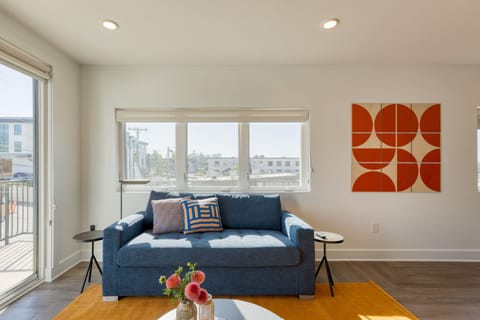 Living room off the balcony featuring a sleeper sofa.