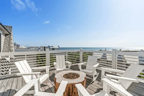 Cozy up by the fire pit on the sun deck, perfect for evenings under the stars.