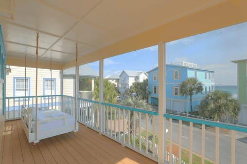 A swing chair on the balcony, offering the perfect spot to relax and soak in breathtaking ocean views.