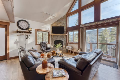 Spacious living area with floor-to-ceiling windows.