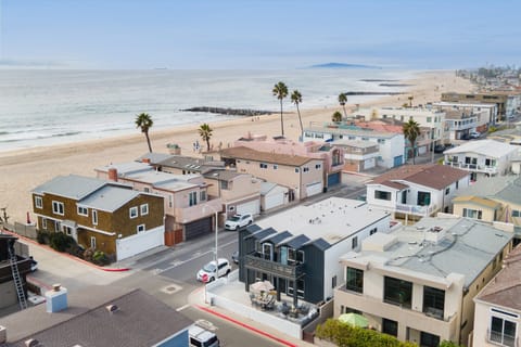 The living room features a large sectional sofa.