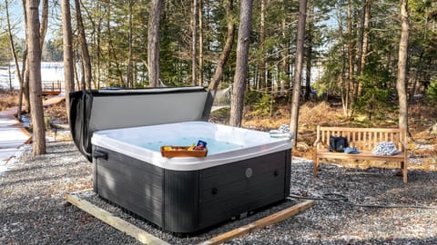 Unwind in the hot tub tucked among the trees, offering a peaceful spot to relax after a day exploring the Smoky Mountains.