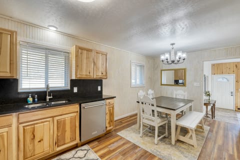 Bedroom 2 in the main house features a queen bed and a TV.