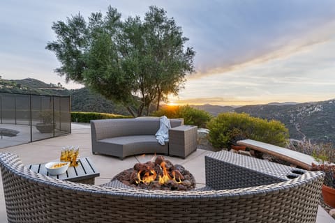 Relax by the firepit with breathtaking mountain views all around!