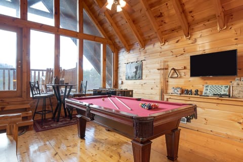 Entertainment Paradise: pool table, foosball, and a big-screen TV.