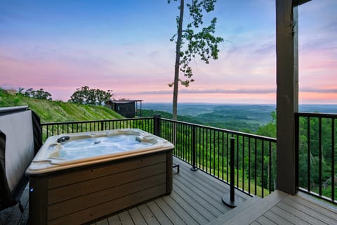 Soak in the hot tub on the deck while taking in stunning mountain views.