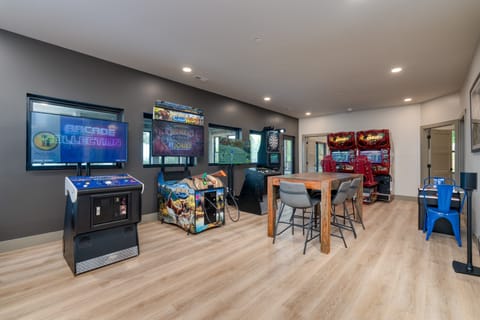 Spacious game room featuring multiple games for hours of family fun and friendly competition.