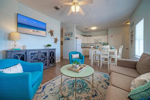 Coastal-inspired décor, plush seating, and a sleeper sofa in the living room. (203)