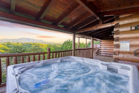 Soak in your private hot tub as you look toward the peaks.