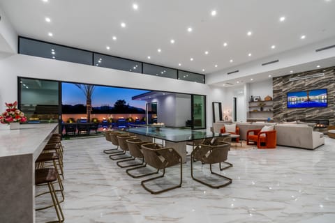 Aerial view of the modern luxury community with sleek homes, private pools, and scenic mountain backdrops.