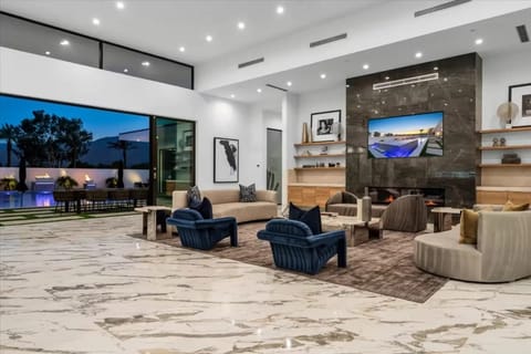 Aerial view of the modern luxury community with sleek homes, private pools, and scenic mountain backdrops.