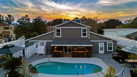 Stunning sunset view of your perfect vacation home with a private pool!