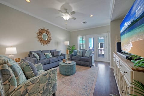 Bright and airy living room with comfortable seating and a smart TV to keep you entertained.