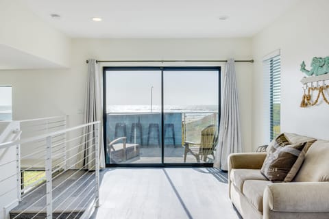 Sleeper sofa and balcony access.