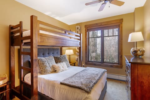 Bedroom 2 features a twin-over-queen bunk bed.