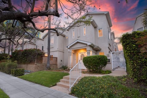 Basking in the golden glow, our home stands as a warm embrace against the evening sky.