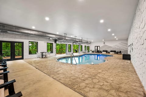 Spacious shared indoor pool with lounge area.