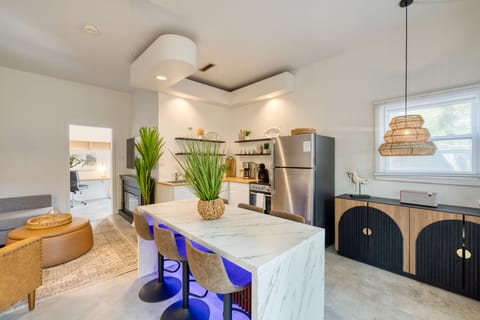 Upgrade your dining experience with a center island table and barstool seating.