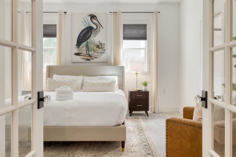 Bedroom 2 features a king bed and a television.