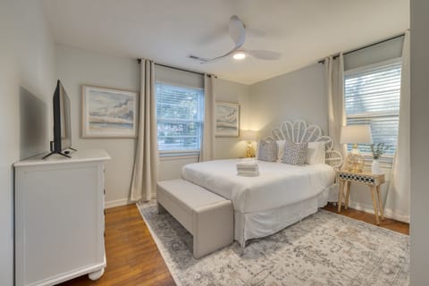Bedroom 1 features a queen bed and a TV.