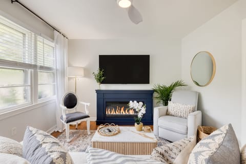 Main House: Living area with TV and fireplace.