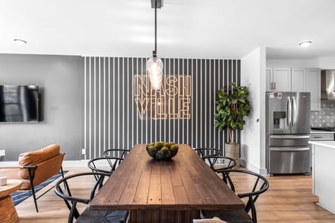 Chic dining area with charming backdrop.