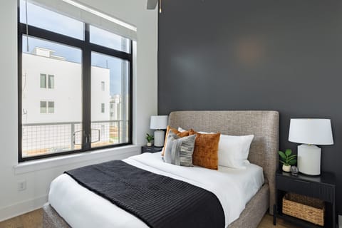 Bedroom 2 features a queen bed. (The Heights 401)