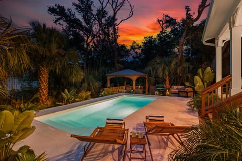 Fiery sunset illuminating the backyard deck.