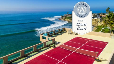 Lounge poolside by the fire pit with stunning ocean views.