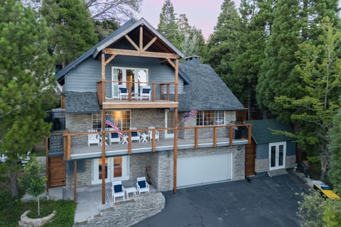 Exterior view of the multi-level home surrounded by trees.