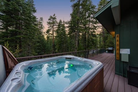 Relaxing outdoor hot tub on private deck.