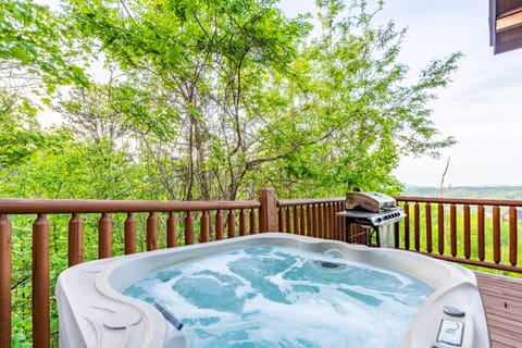 Fire up the grill while enjoying the private hot tub. (Hollow's Haven)
