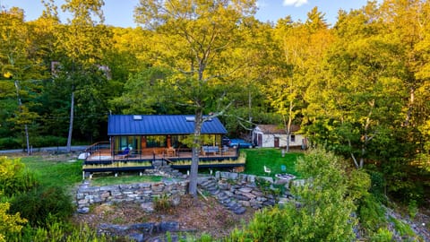 A rustic-modern open-concept kitchen and living area.
