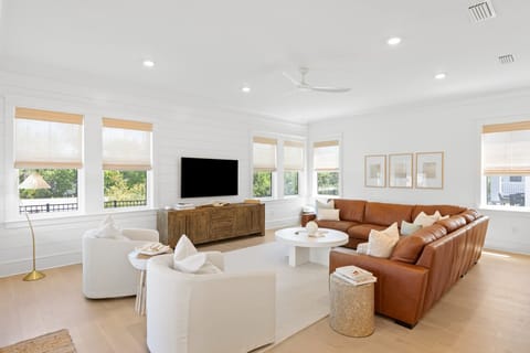 Open-concept living room with ample natural light. (Seeley by the Sea)