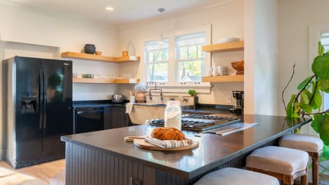 Modern kitchen with barstool seating.