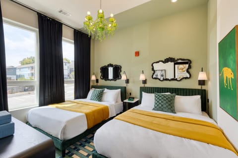 Unit 101 Bedroom 2 features two queen beds.