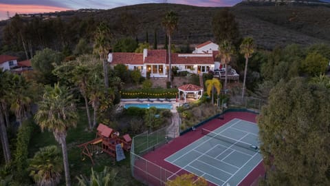 This resort-like backyard offers something for everyone, from the tennis enthusiast to the sunbather. (The Tennis Ranch)
