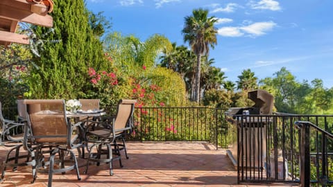 Patio with al fresco dining and BBQ grill.