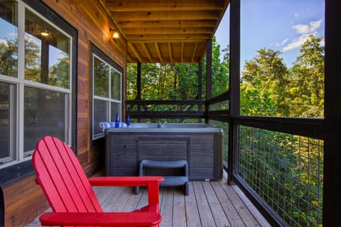 Unwind and soak your cares away in the hot tub, with a serene view of the surrounding woods.
