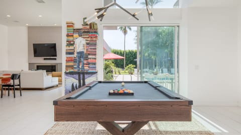 Upscale, luxe interior boasts plenty of ways to keep your group entertained, including a pool table surrounded by natural light. (Polo Villa 6)