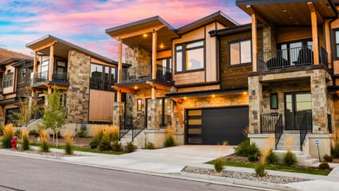 Experience modern mountain living at its finest. This stunning architectural gem welcomes you home under a vibrant Park City sky.