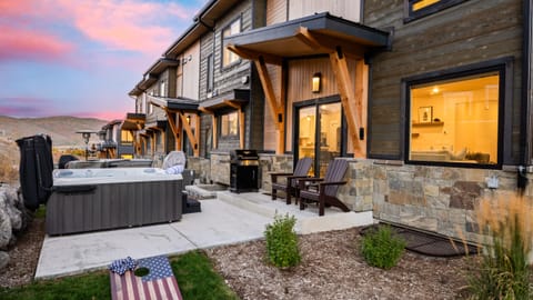 Hot tub and BBQ patio featuring mountain views.