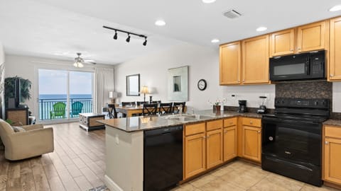 Unit 506: Open kitchen with modern appliances.